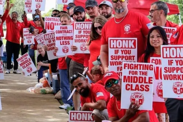 CWA AT&T members holding strike signs