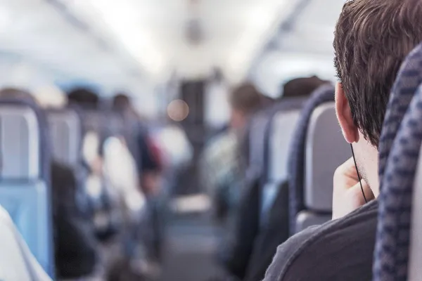 man_on_crowded_plane.jpg