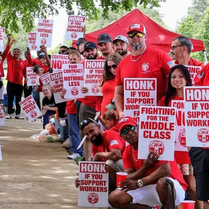 CWA AT&T members holding strike signs