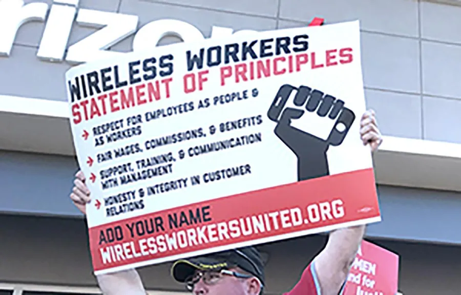 wireless_worker_with_sign.jpg